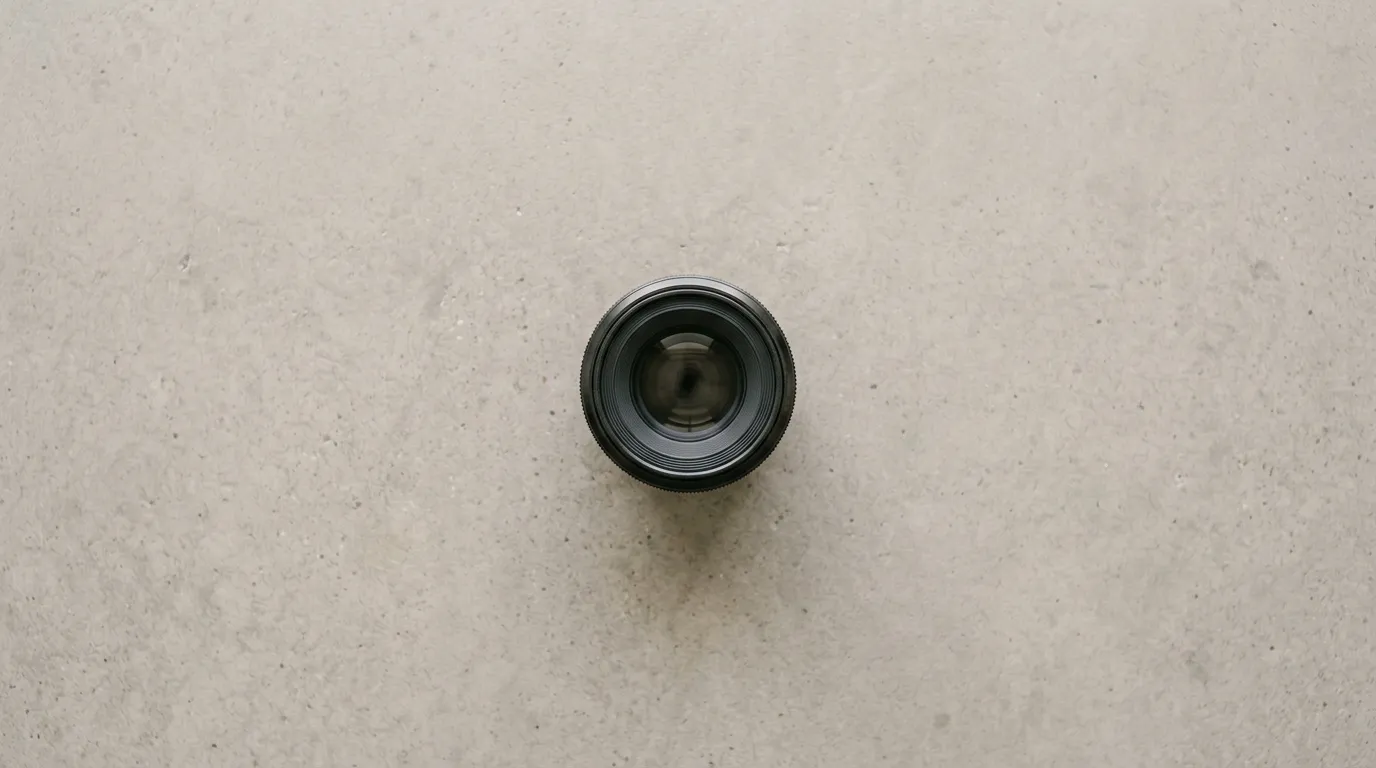 Lens language — focal length and aperture — does more for realism than any quality keyword.