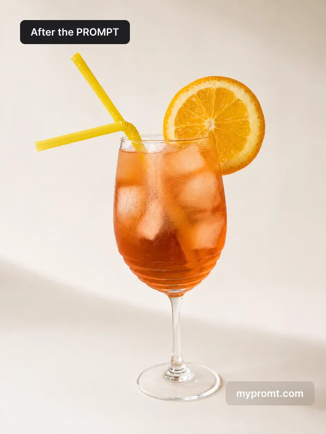Iced orange drink with an orange slice and straw on a seamless ivory studio background