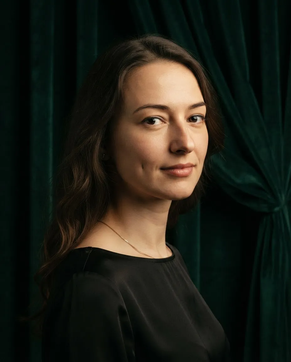 Classic studio portrait against heavy velvet drapery falling in deep folds